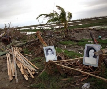 Portraits of dead locals hung on what is left of their home May 20, 2008, at the isolated village of Myasein Kan in the Ayeyarwaddy delta, Myanmar. It has been estimated that more than 100,000 people were killed by Cyclone Nargis. (International Aid Agenci/Getty Images) Portraits of dead locals hung on what is left of their home May 20, 2008, at the isolated village of Myasein Kan in the Ayeyarwaddy delta, Myanmar. It has been estimated that more than 100,000 people were killed by Cyclone Nargis. (International Aid Agenci/Getty Images)