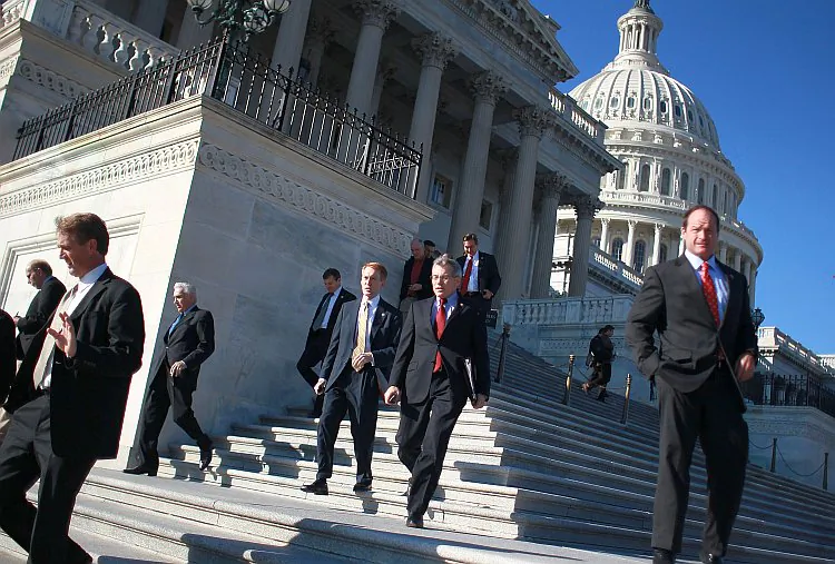 Members of Congress leave the U.S. Capitol after the House went on recess for the Thanksgiving break, on Nov. 18. With a deadline looming, the Join Select Committee on Deficit Reduction will continue working to cut trillions of dollars from the budget before the Thanksgiving deadline. (Mark Wilson/Getty Images)