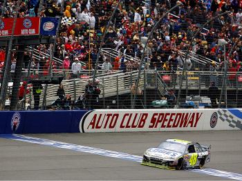 Jimmie Johnson crosses the finish line to win the NASCAR Sprint Cup Series Auto Club 500. (Tom Pennington/Getty Images for NASCAR) Jimmie Johnson crosses the finish line to win the NASCAR Sprint Cup Series Auto Club 500. (Tom Pennington/Getty Images for NASCAR)