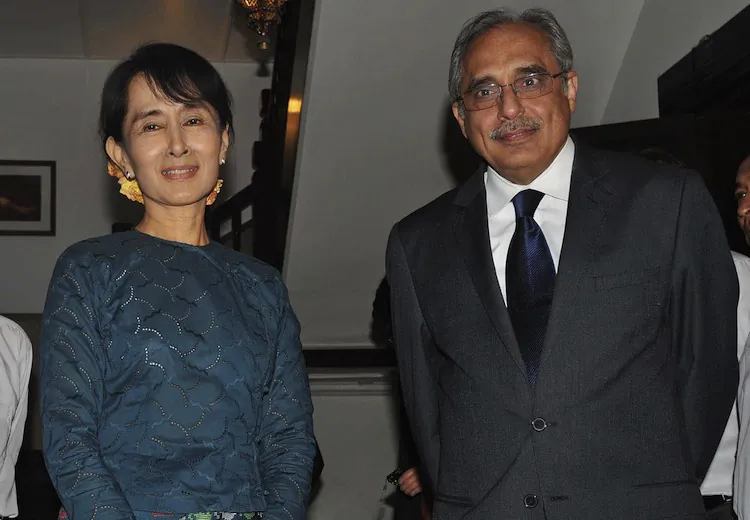 Burma democracy icon Aung San Suu Kyi (L) poses for pictures with Vijay Nambiar, chief of staff to UN Secretary General Ban Ki-moon, following their meeting at her house in Yangon on November 3, 2011. (Soe Than Win/AFP/Getty Images)
