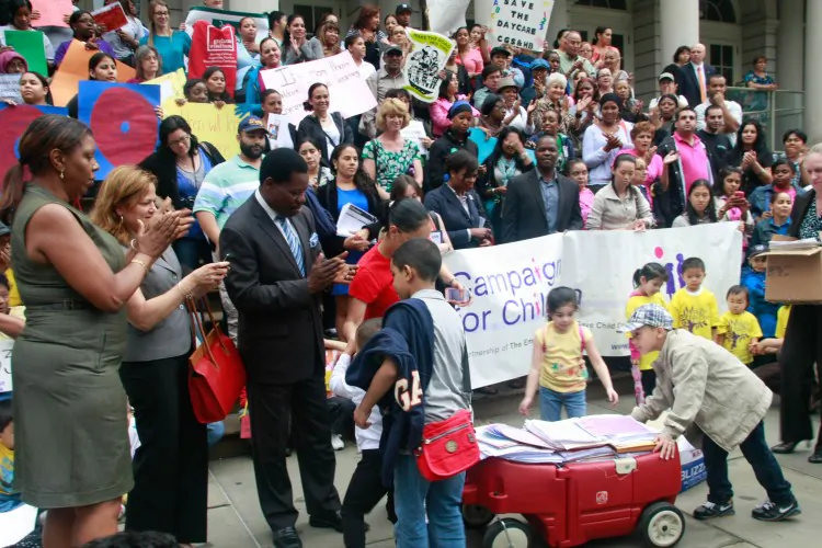 The Campaign for Children held a rally on the steps of City Hall Wednesday to deliver 47,000 letters to the mayor and City Council in a little red wagon. (Aric Chen/The Epoch Times)