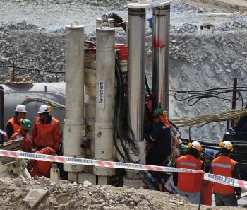 Rescuers drill a new hole with their new Strata 950 excavator at the San Jose mine, Copiapo, Chile, September 2, 2010. The morale of 33 miners trapped in Chile soared Wednesday after music and hot meals were supplied, while NASA advisers praised their 'courage' and provided advice on daylight deprivation, as a rescue drill inched closer. (Martin Mejia/Getty Images)