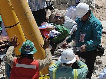Chilean miner Omar Reygadas smiles while taken on a trolley to the field hospital for a checkup after being brought to the surface from the depths of the San Jose mine, near Copiapo, Chile, on October 13, 2010. (Rodrigo Arangua/AFP/Getty Images) Chilean miner Omar Reygadas smiles while taken on a trolley to the field hospital for a checkup after being brought to the surface from the depths of the San Jose mine, near Copiapo, Chile, on October 13, 2010. (Rodrigo Arangua/AFP/Getty Images)