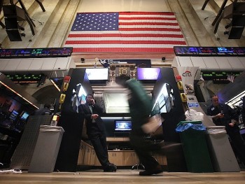 Traders work on the floor of the New York Stock Exchange in early 2011. In the beginning of June, short seller Muddy Waters Research released a report that dramatically reduced the value of Sino-Forest stock. This was just the first of several Chinese companies being assessed by Muddy Waters. (Mario Tama/Getty Images)