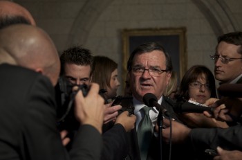 Finance Minister Jim Flaherty told reporters on Parliament Hill Wednesday that the government was prepared to take pragmatic measures if the Canadian economy takes a hit. (Matthew Little/The Epoch Times)