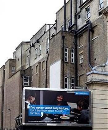 A family walk past one of the Conservative party's new nationwide poster campaigns on February 15, 2010 in London (Dan Kitwood/Getty Images)