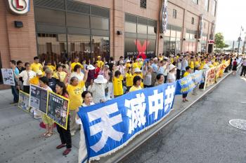 Practitioners hold a rally outside of the Chinese consulate in Manhattan on July 20, the ten-year commemoration of the State-sponsored persecution that has killed thousands. (Edward Dai/The Epoch Times)