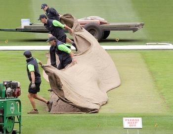 A green pitch that will favor Australia's pace bowlers is being prepared as ground staff remove covers at the MCG on Dec 22. (William West/AFP/Getty Images) A green pitch that will favor Australia's pace bowlers is being prepared as ground staff remove covers at the MCG on Dec 22. (William West/AFP/Getty Images)