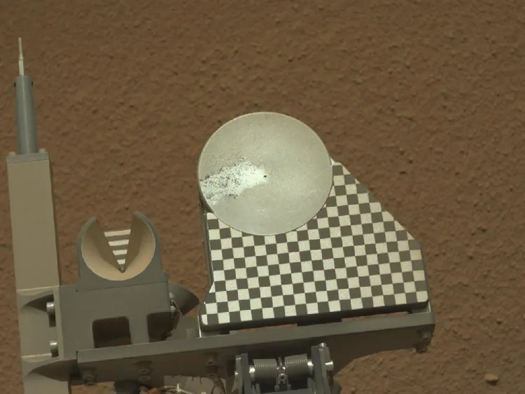 The robotic arm on NASA's Mars rover Curiosity delivered a sample of Martian soil to the rover's observation tray for the first time during the mission's 70th Martian day, or sol (Oct. 16, 2012). (NASA/JPL-Caltech/MSSS)