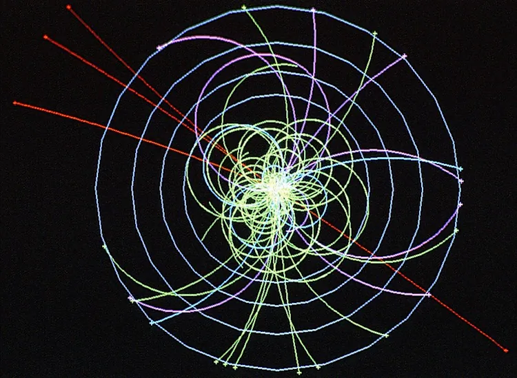 Example of simulated data of a Higgs boson decay path, which is produced when two protons collide at 14 TeV, and quickly decays into four muons, a type of heavy electron not absorbed by the detector. The muon tracks are shown in red. (CERN)