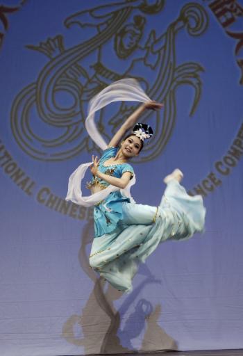 Contestant #13 Jialin Chen of the Junior Female division leaps during a solo performance in the 2nd NTDTV Chinese Classical Dance Competition preliminaries on August 22 at the Town Hall Foundation in New York City. (Bing Dai/The Epoch Times)