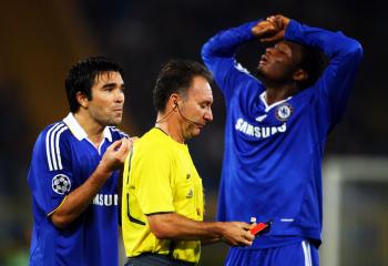 BAD NIGHT: Deco (left) pleads with the ref after being shown a red card while John Obi Mikel expresses his disappointment. (Jamie McDonald/Getty Images)