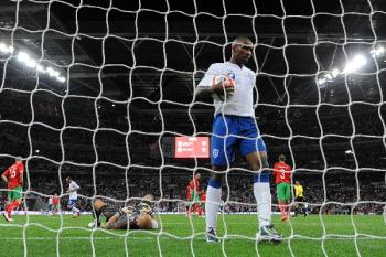 ENGLAND VS BULGARIA: England's Jermain Defoe in foreground, picks the ball out of the net after teammate Adam Johnson scored against Bulgaria during the qualifying Euro football match at Wembley Stadium on September 3, 2010. (Adrian Dennis/AFP/Getty Images )