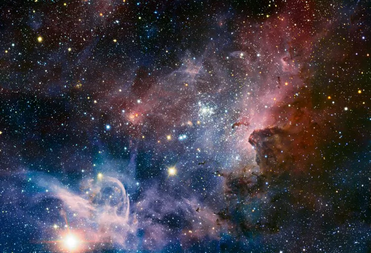 This broad panorama of the Carina Nebula, a region of massive star formation in the southern skies, was taken in infrared light using the HAWK-I camera on ESO’s Very Large Telescope. (ESO/T. Preibisch)
