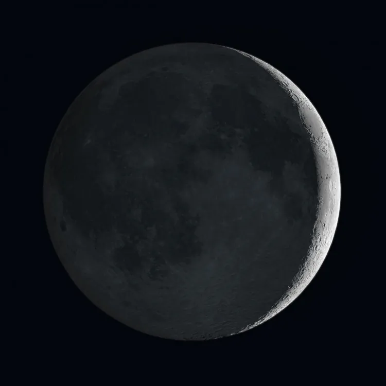 When the moon appears as a thin crescent, the rest of the disk may also faintly glow due to sunlight reflecting off the Earth and illuminating the lunar surface. (ESO/NASA/M. Kornmesser)