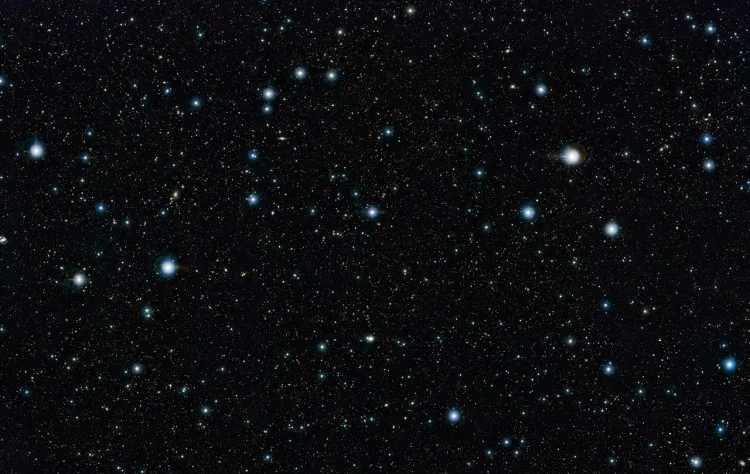 This view shows some highlights from widest deep view of the sky ever taken using infrared light, with a total effective exposure time of 55 hours. It was created by combining more than 6000 individual images from the VISTA survey telescope at ESO’s Paranal Observatory in Chile. This picture shows a region of the sky known as the COSMOS field in the constellation of Sextans (The Sextant). (ESO/UltraVISTA team. Acknowledgement: TERAPIX/CNRS/INSU/CASU)