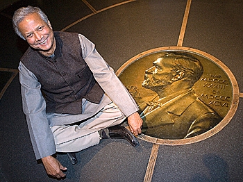 NOBEL WINNER: Professor Muhammed Yunus sits beside a Nobel Prize emblem at the Nobel Peace Center in Oslo, Norway. Professor Yunus won the Nobel Peace Prize in 2006. (Courtesy of Muhammad Yunus) NOBEL WINNER: Professor Muhammed Yunus sits beside a Nobel Prize emblem at the Nobel Peace Center in Oslo, Norway. Professor Yunus won the Nobel Peace Prize in 2006. (Courtesy of Muhammad Yunus)