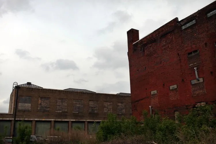 Closed factories seen earlier this month in Utica, N.Y. Over the years, most of America’s manufacturing capabilities have been outsourced to third-world countries in an effort to eliminate labor costs and boost earnings, according to a number of economists. (Spencer Platt/Getty Images)