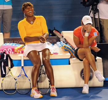Serena Williams (L) and Samantha Stosur enjoy the action during a charity tennis exhibition organised by Swiss tennis player Roger Federer for the victims of the Haiti earthquake. (William West/AFP/Getty Images) Serena Williams (L) and Samantha Stosur enjoy the action during a charity tennis exhibition organised by Swiss tennis player Roger Federer for the victims of the Haiti earthquake. (William West/AFP/Getty Images)