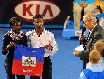 Haitian visitors Marckenson Brown (2nd R) and Zoe Doran (L) are introduced to the crowd after Hit for Haiti, January 17, 2010. (William West/AFP/Getty Images) Haitian visitors Marckenson Brown (2nd R) and Zoe Doran (L) are introduced to the crowd after Hit for Haiti, January 17, 2010. (William West/AFP/Getty Images)