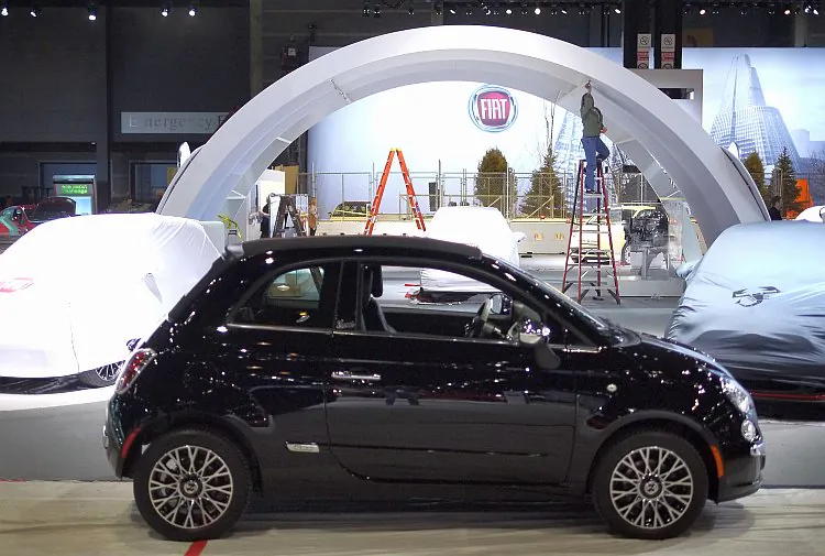 A Fiat 500 subcompact is prepared for display at the Chicago Auto Show on Feb. 7. The Fiat 500 had huge sales gains in March, benefitting from high gas prices and clever marketing. (Scott Olson/Getty Images)