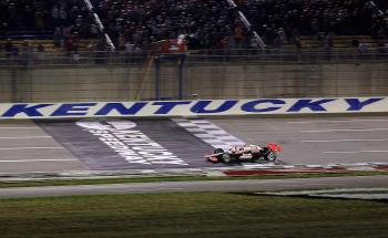 Helio Castroneves crosses the finish line all alone to win the IndyCar Series Kentucky Indy 300. (Streeter Lecka/Getty Images) Helio Castroneves crosses the finish line all alone to win the IndyCar Series Kentucky Indy 300. (Streeter Lecka/Getty Images)