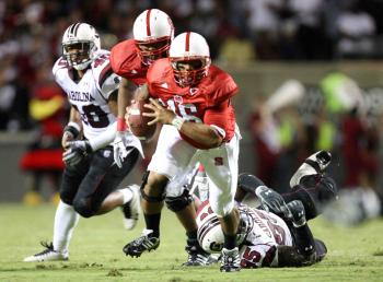 AT LONG LAST: North Carolina (in red) and South Carolina kicked off the college football season on Thursday night. (Streeter Lecka/Getty Images)