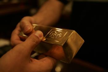 Gold prices have escalated to more than $1,298 per ounce. (Joseph Eid/AFP/Getty Images)