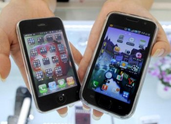 Gorilla Glass: Two smartphone handsets that that are perfect candidates for an ultra-hard type of glass by Corning dubbed 'gorilla glass.' Here Samsung Electronics' Galaxy S mobile phone (R) and Apple's iPhone 3G are shown at a shop in Seoul on July 27. (Park Ji-Hwan/AFP/Getty Images)