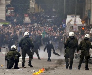 AUSTERITY RIOTS: Demonstrators face riot police during clashes in Athens on Dec. 15. (Aris Messinis/AFP/Getty Images) AUSTERITY RIOTS: Demonstrators face riot police during clashes in Athens on Dec. 15. (Aris Messinis/AFP/Getty Images)