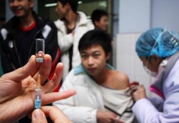 A student is being given the H1N1 vaccine shot. (AFP/Getty Images)