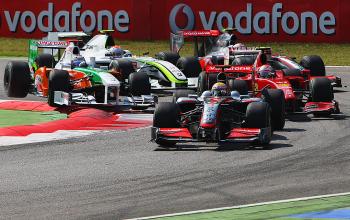 Lewis Hamilton (F) leads the field at the start of the Italian Formula One Grand Prix at Monza. Adrian Sutil (L) is forced over the curb by Kimi Raikonnen, while Rubens Barrichello (2L) squeezes under Heiki Kovalainen (R). (Mark Thompson/Getty Images) Lewis Hamilton (F) leads the field at the start of the Italian Formula One Grand Prix at Monza. Adrian Sutil (L) is forced over the curb by Kimi Raikonnen, while Rubens Barrichello (2L) squeezes under Heiki Kovalainen (R). (Mark Thompson/Getty Images)