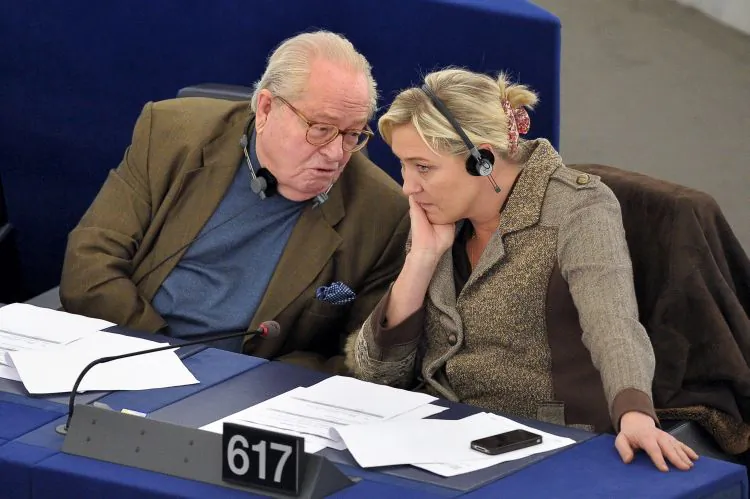 Jean-Marie Le Pen (L) the far-right ex-leader of the National Front Party sits with his daughter, Marine Le Pen, his successor. Jean-Marie Le Pen was convicted for downplaying the Nazi occupation of France. (Fredrick Florin/AFP/Getty Images)