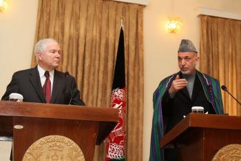 Afghan President Hamid Karzai (R) gestures during a press conference with U.S. Secretary of Defense Robert Gates at the Presidential Palace Dec. 8, in Kabul, Afghanistan. Secretary Gates is embarking on a weeklong trip to Afghanistan one week after U.S. P (Justin Sullivan/Getty Images)