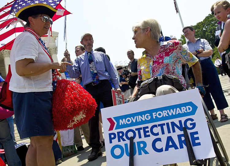 Protesters argue about the Affordable Healthcare Act outside the U.S. Supreme Court on June 28 in Washington, D.C. Now that the Court has found the act constitutional, states have numerous deadlines to meet before reforms are scheduled to begin January 2014. (Kris Connor/Getty Images)