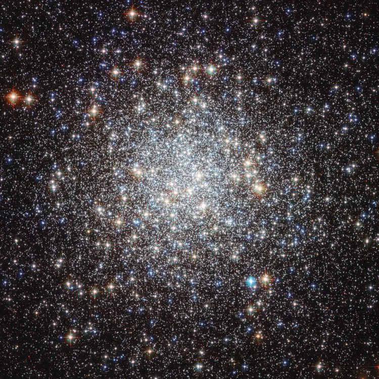 This image from the NASA/ESA Hubble Space Telescope shows the globular cluster Messier 9. Hubble’s image resolves stars right into the centre of the cluster, and clearly shows they have different colours. Redder colours signify lower surface temperatures, while blue stars are extremely hot. (NASA & ESA)