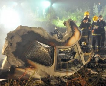 Chinese firefighters search the cockpit of the Henan Airlines ERJ-190 jet wreckage at the crashsite in the northeast city of Yichun in remote Heilongjiang province early on August 25, 2010. A large number of Chinese pilots falsify their flight credentials in order to land better jobs. (STR/AFP/Getty Images)