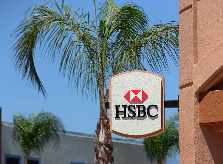 A cyclist passes an HSBC bank branch in Los Angeles, July 17. U.K.-based HSBC apologized at a U.S. Senate hearing Tuesday for failing to guard against money laundering that was said to benefit Mexican drug lords, terrorist networks, and Iran. (Frederic J. Brown/AFP/GettyImages)
