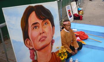 MR. Maung Maung Tate sits by a picture of the imprisoned Burmese leader, Aung San Suu Kyi, on the fourth day of his hunger strike. He and other Burmese protesters are calling for her release by the Burmese regime. Aung San Suu Kyi was elected prime minister in 1990, but was arrested by the military. (Phil Randell/The Epoch Times) MR. Maung Maung Tate sits by a picture of the imprisoned Burmese leader, Aung San Suu Kyi, on the fourth day of his hunger strike. He and other Burmese protesters are calling for her release by the Burmese regime. Aung San Suu Kyi was elected prime minister in 1990, but was arrested by the military. (Phil Randell/The Epoch Times)