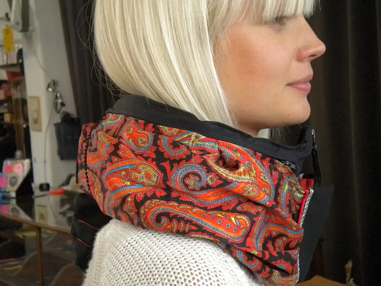 Hovding, the invisible bike helmet in black. Showing the airbag in the activated position. (Hoding, Sweden)