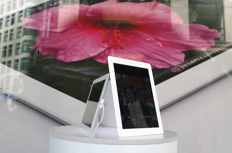 An iPad is seen in a window display at an Apple Store on April 24, in San Francisco, Calif. Apple set a record, becoming the most valuable company in history by market capitalization. (Justin Sullivan/Getty Images)