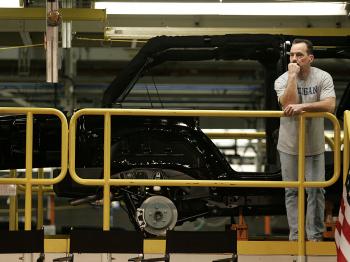 A worker at a Chrysler/Jeep factory in Toledo, Ohio, look over the plant floor. Chrysler closed all its plants for thirty days, to try to avoid bankruptcy.  (J.D. Pooley/Getty Images)