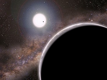 Artists conception of Kepler-19c, the 'invisible' world, in the foreground, orbiting its sun-like star, Kepler-19. (David A. Aguilar/CfA)