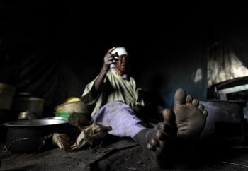 Peris, 92, sits in her makeshift tent that she's lived in for three years at 'Ya-Mumbi' IDP camp in Eldoret town December 15, 2010 as she waits for ICC's announcement of primary suspects of the 2007-08 post-electoral violence that killed more than a thousand Kenyans. (Tony Karumba/AFP/Getty Images)