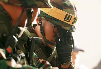 South Korean soldiers take shelter in a bunker during a live-fire exercise on Yeonpyeong island near the disputed waters of the Yellow Sea on Dec. 20. (Korea Pool/AFP/Getty Images) South Korean soldiers take shelter in a bunker during a live-fire exercise on Yeonpyeong island near the disputed waters of the Yellow Sea on Dec. 20. (Korea Pool/AFP/Getty Images)