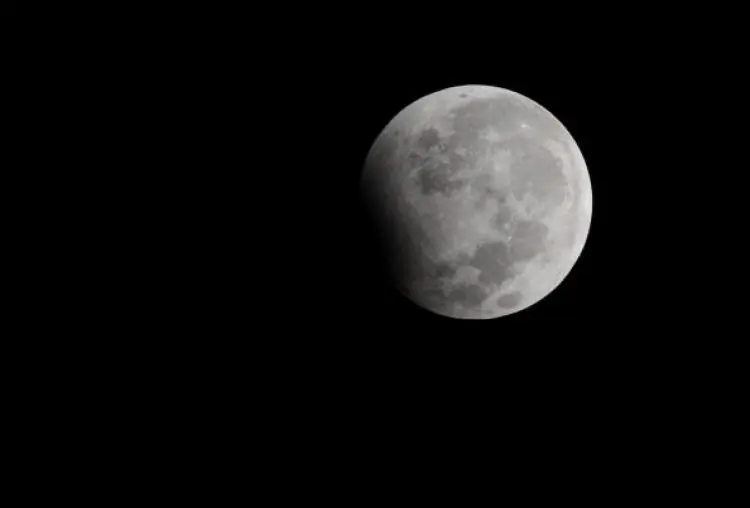 A partial eclipse of the moon observed in the sky above Kolkata early Jan. 1, 2010. (Deshakalyan Chowdhury/AFP/Getty Images)