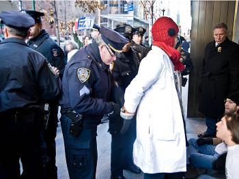 Police handcuff a protester. (Aloysio Santos/The Epoch Times)