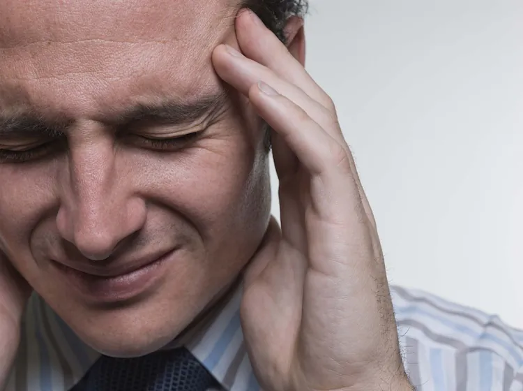 Twenty per cent of the UK population suffer from migraine. A new treatment with a portable magnetic device has shown positive results in clinical trials. (Jupiterimages/photos.com)