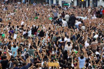Defeated reformist presidential candidate Mir-Hossein Mousavi (C) raises his arms as he appears during a demonstration in the streets on June 15, 2009 in Tehran, Iran. (Getty Images) Defeated reformist presidential candidate Mir-Hossein Mousavi (C) raises his arms as he appears during a demonstration in the streets on June 15, 2009 in Tehran, Iran. (Getty Images)