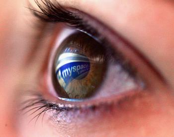 MySpace Layoffs: MySpace is laying off almost 50 percent of its workforce. In this photo illustration the MySpace logo is reflected in the eye of a girl. (Chris Jackson/Getty Images)